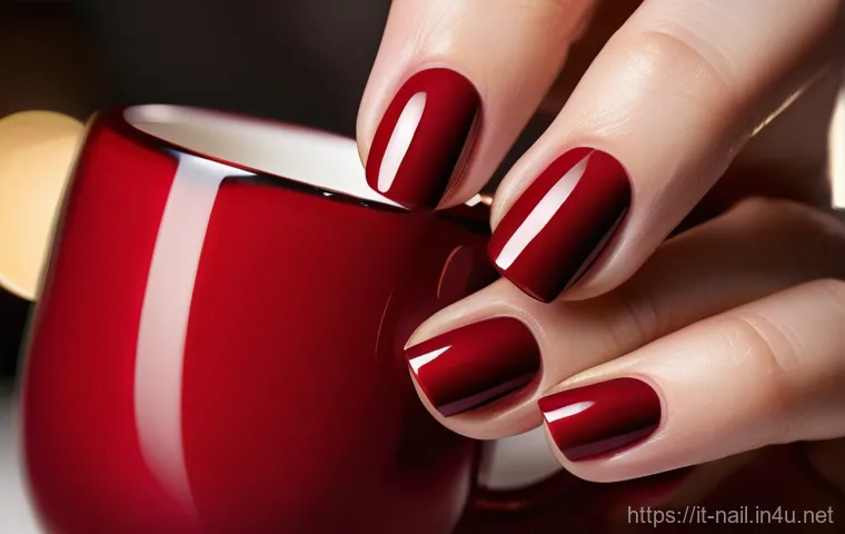 젤 네일 탑코트 고르는 법 - A close-up of elegant, well-manicured hands showcasing a flawless, high-gloss gel manicure. The nail...