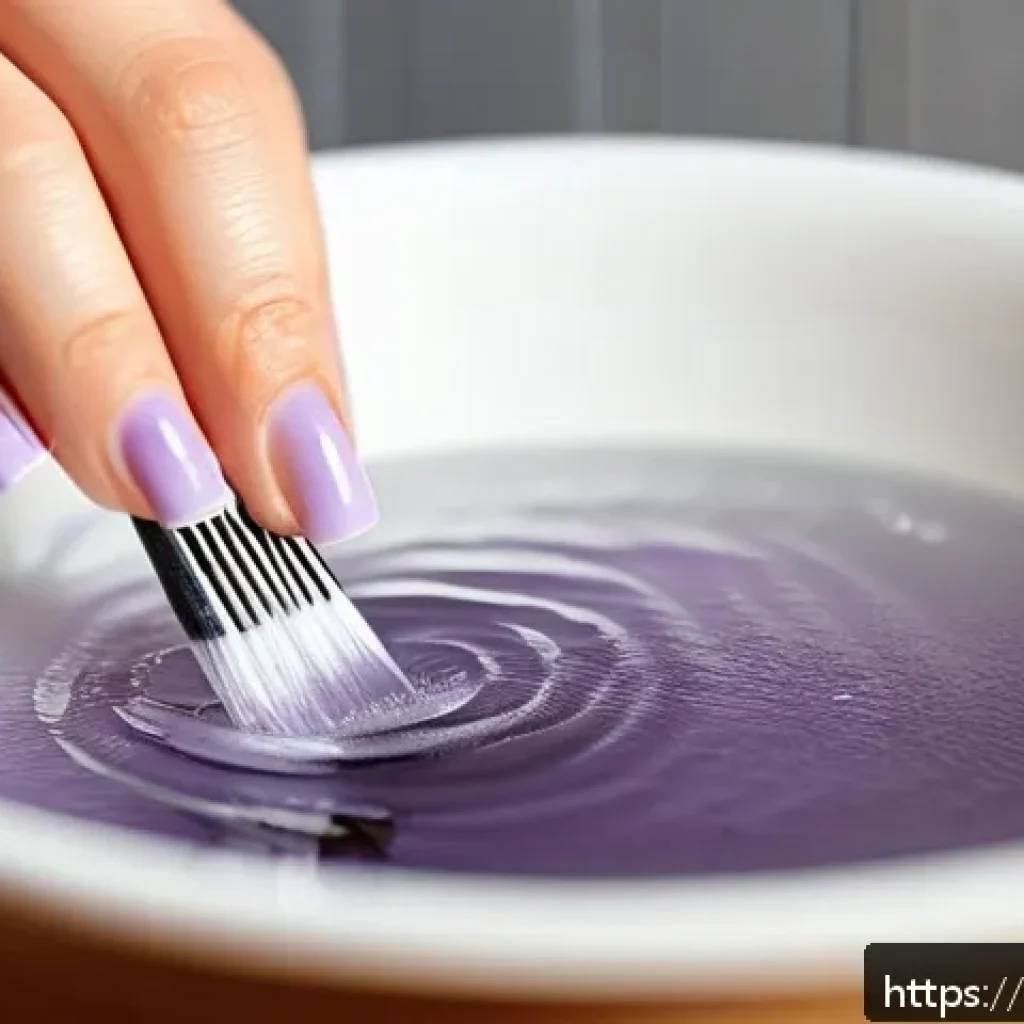손톱 큐티클 리무버 사용법 - A close-up of a well-manicured female hand soaking in a warm bowl of water, with soft lighting highl...
