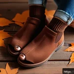 Home 19 가을에 어울리는 페디큐어 컬러 - A close-up image of a woman’s feet featuring a sophisticated autumn pedicure in matte terracotta nai...
